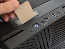 猫咪卧机箱误触电源键频发,养猫族自发创意防护成热潮